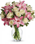 Bouquet of pink and white flowers in a clear vase