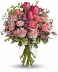 Bouquet of pink flowers in a clear vase
