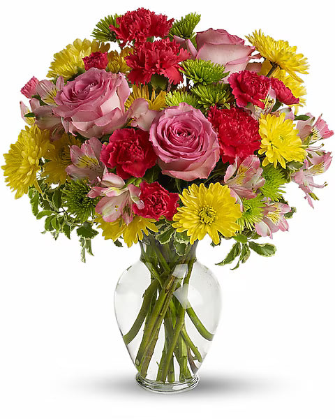 Bouquet of colorful flowers in a clear vase 