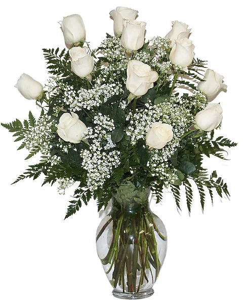 Bouquet of white roses in a clear vase 